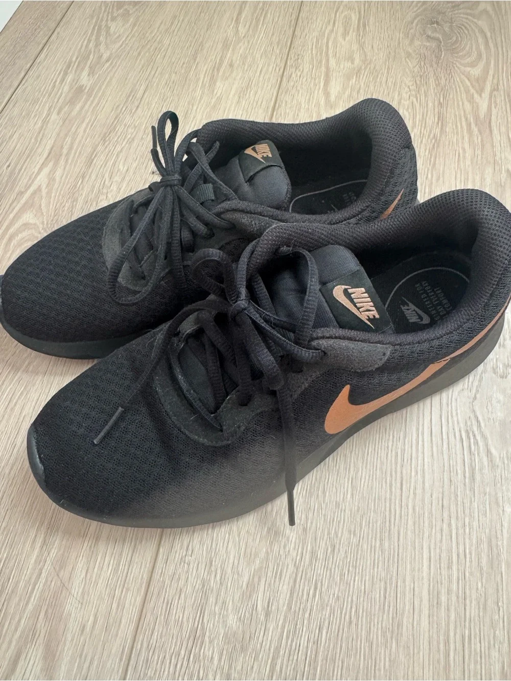 Nike womens Black Sneakers with Copper Swoosh Accent
